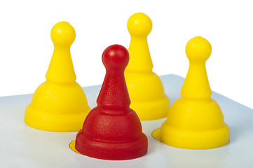 Image showing Red and yellow game pawns white isolated