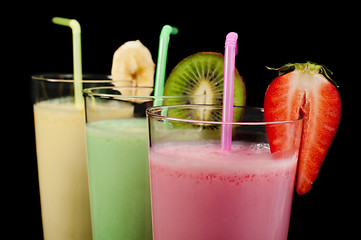 Image showing Banana, kiwi and strawberry milk shake and fresh fruis