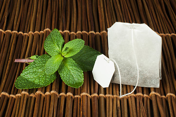 Image showing Tea bag and fresh mint