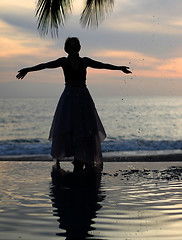 Image showing Woman watching sunset