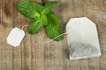 Image showing Tea bag and fresh mint