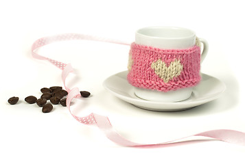 Image showing Cup of coffee with knitted heart symbol