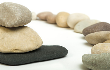 Image showing Stacked stones white isolated