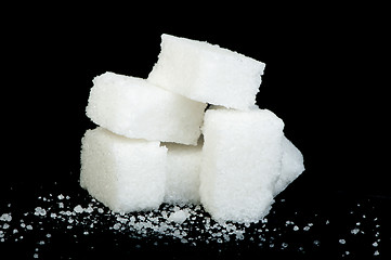 Image showing Sugar lumps black isolated