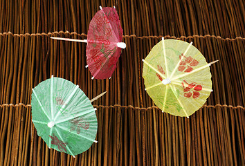 Image showing Colorful cocktail umbrellas