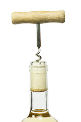 Image showing A bottle of white wine and a corkscrew