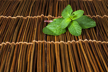 Image showing Mint leaves on wooden base