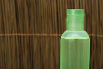 Image showing Green transparent cosmetic bottle