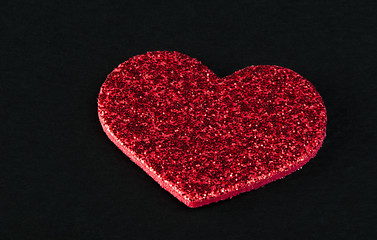 Image showing Red shiny hearts on black background