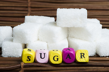 Image showing Sugar lumps and text