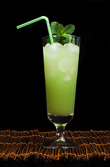 Image showing Green cocktail with cubes ice