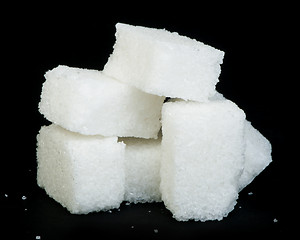 Image showing Sugar lumps black isolated