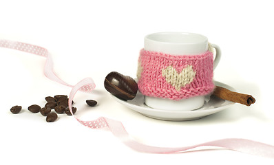 Image showing Cup of coffee with knitted heart symbol