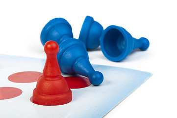 Image showing Red and blue game pawns white isolated