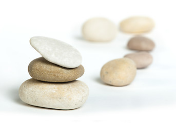 Image showing Stacked stones white isolated