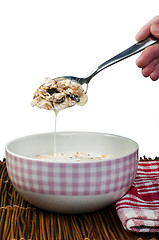 Image showing Muesli breakfast in a bow and spoon