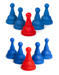 Image showing Red and blue game pawns white isolated