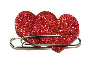 Image showing Two red hearts attached with a paper clip