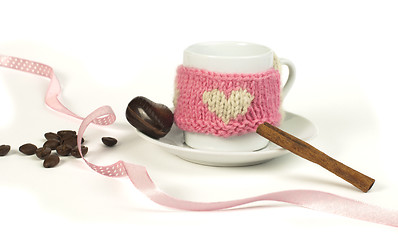 Image showing Cup of coffee with knitted heart symbol