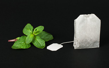 Image showing Tea bag and fresh mint