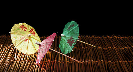 Image showing Colorful cocktail umbrellas