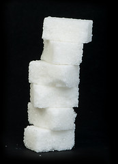 Image showing Sugar lumps black isolated