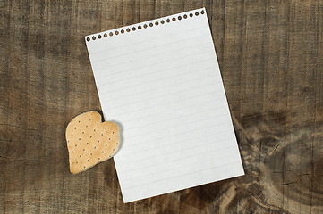 Image showing Heart shape cookie on wooden background