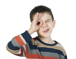 Image showing Child looking through his ??hands