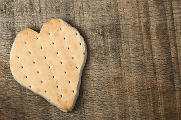 Image showing Heart shape cookie on wooden background