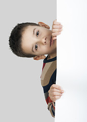 Image showing Little boy holding a whiteboard