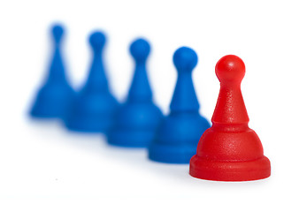 Image showing Red and blue game pawns white isolated