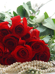 Image showing Closeup of a Dozen Roses and Pearls