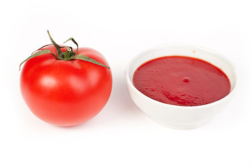 Image showing Tomato and Bowl of tomato sauce