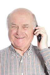 Image showing Senior man laughing while talking on phone