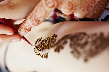 Image showing Henna art on woman's hand