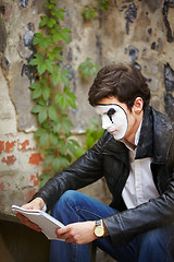 Image showing Mime guy reads his book