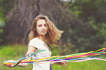 Image showing Beautiful girl with ribbons