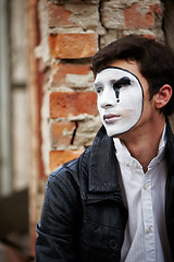 Image showing Guy mime against an old brick wall.