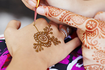 Image showing Henna art on woman's hand