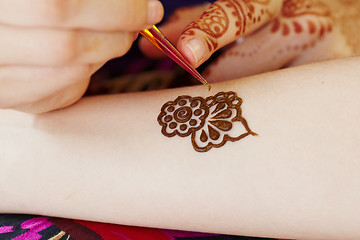 Image showing Henna art on woman's hand