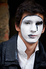 Image showing Guy mime against an old brick wall.