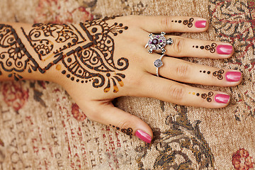 Image showing Henna art on woman's hand