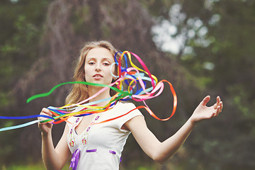 Image showing Beautiful girl with ribbons