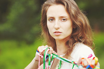 Image showing Beautiful girl with ribbons