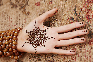 Image showing Henna art on woman's hand