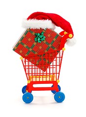 Image showing Big present and Santa hat in toy shopping cart