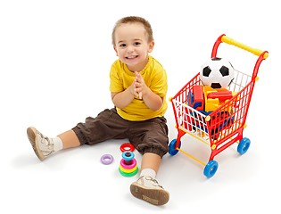 Image showing Happy little boy, playing with new toys