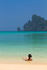 Image showing Young womand relaxing at the beach