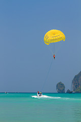 Image showing Parachute surfer being hauled by a motorboat