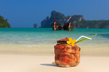 Image showing Coconut cocktail on the beach